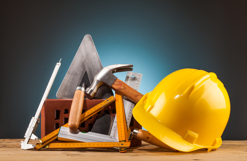 yellow helmet brick and builder tools